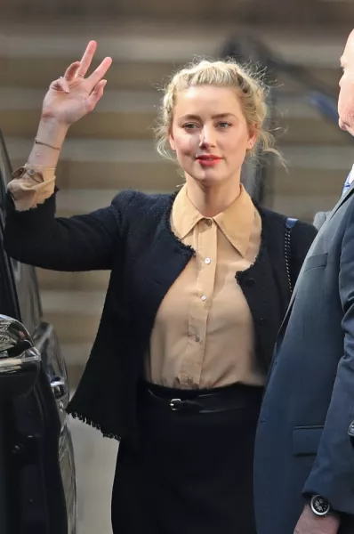 Amber Heard leaving the High Court in London (Aaron Chown/PA)