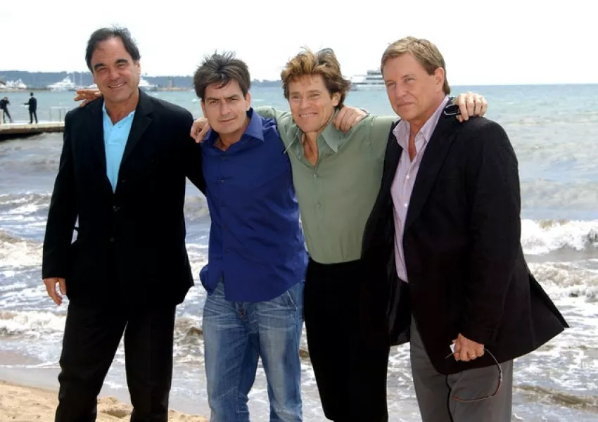 Oliver Stone with the stars of Platoon, Charlie Sheen, Willem Dafoe and Tom Berenger (Anthony Harvey/PA)