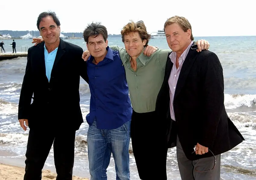 Oliver Stone with the stars of Platoon, Charlie Sheen, Willem Dafoe and Tom Berenger (Anthony Harvey/PA)