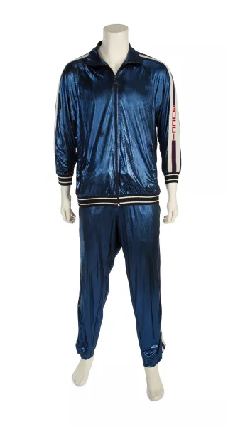A Gucci tracksuit once belonging to Sir Elton John is going under the hammer (Julien’s Auctions/PA)
