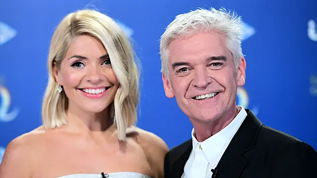 Holly Willoughby And Phillip Schofield Reunite With Hug Through ‘Cuddle Curtain’