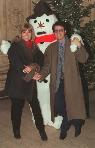 With Sir Cliff Richard in 1997 at a Christmas concert at the Royal Albert Hall, London (PA)