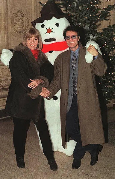 With Sir Cliff Richard in 1997 at a Christmas concert at the Royal Albert Hall, London (PA)