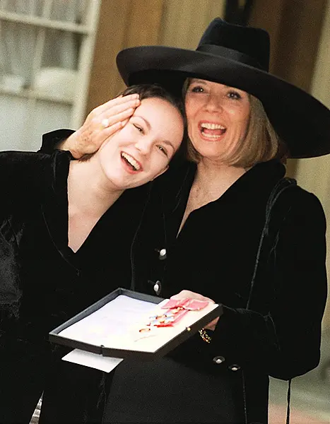 With 17-year-old daughter Rachael, at Buckingham Palace, where she was made a Dame Commander of the British Empire (PA)