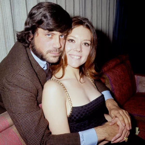 Oliver Reed embraces Diana Rigg at a press call for the film The Assassination Bureau in 1969 (PA)
