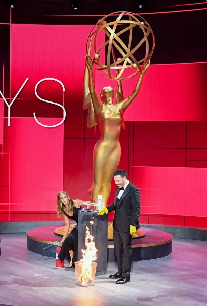 Jennifer Aniston and Jimmy Kimmel jokingly set an envelope alight during the 2020 Emmys (TV Academy/PA)