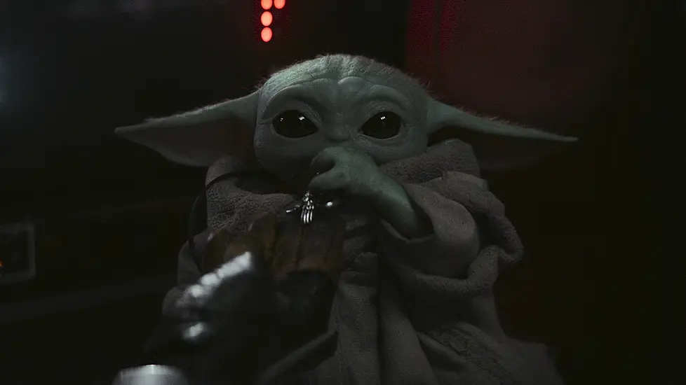 The Mandalorian Cradles Baby Yoda In Latest Footage From Star Wars Spin-Off