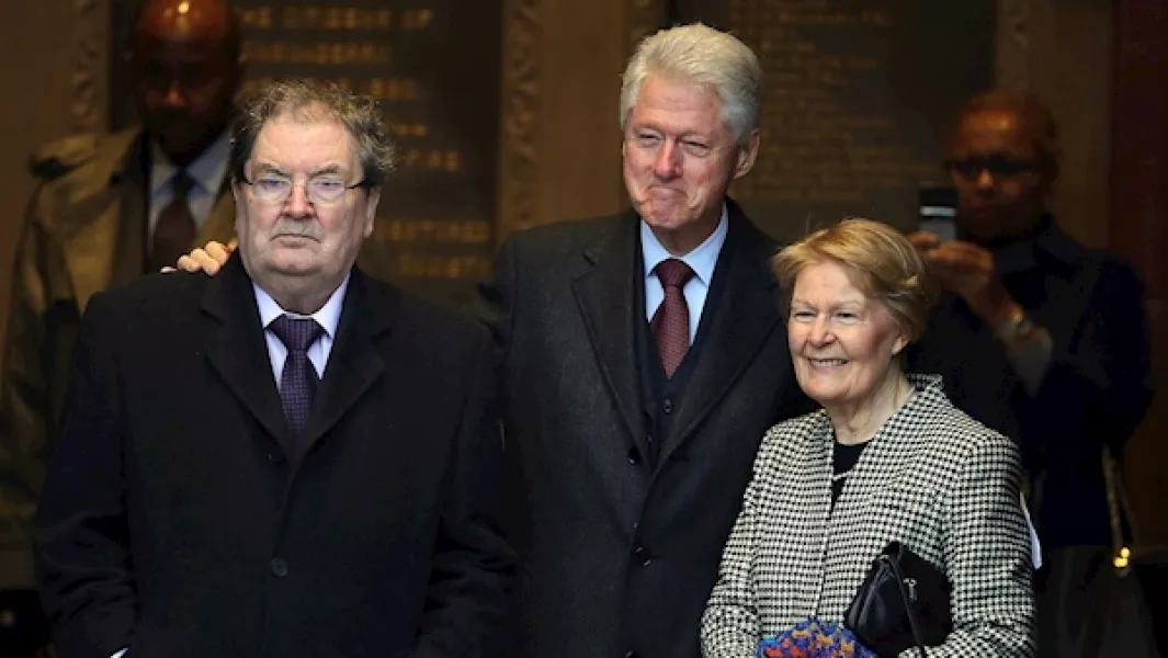 Former US president Bill Clinton (centre) with John Hume and his wife Pat at the Guildhall in Derry in 2014