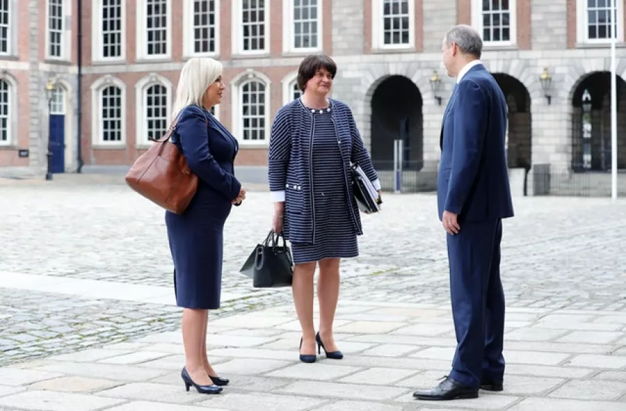 First Minister Arlene Foster (centre) and deputy First Minister Michelle O’Neill greet Taoiseach Micheal Martin (Kelvin Boyes/Press Eye/PA)