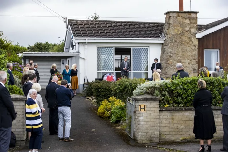 Prayers were said outside the family home in Castlerock, near Coleraine, before the funera at Downhill Burying Ground (Liam McBurney/PA)