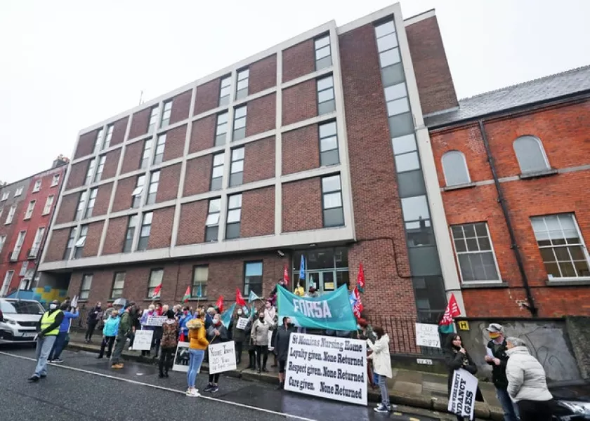 Staff outside St Monica’s Nursing Home in Dublin (Niall Carson/PA)