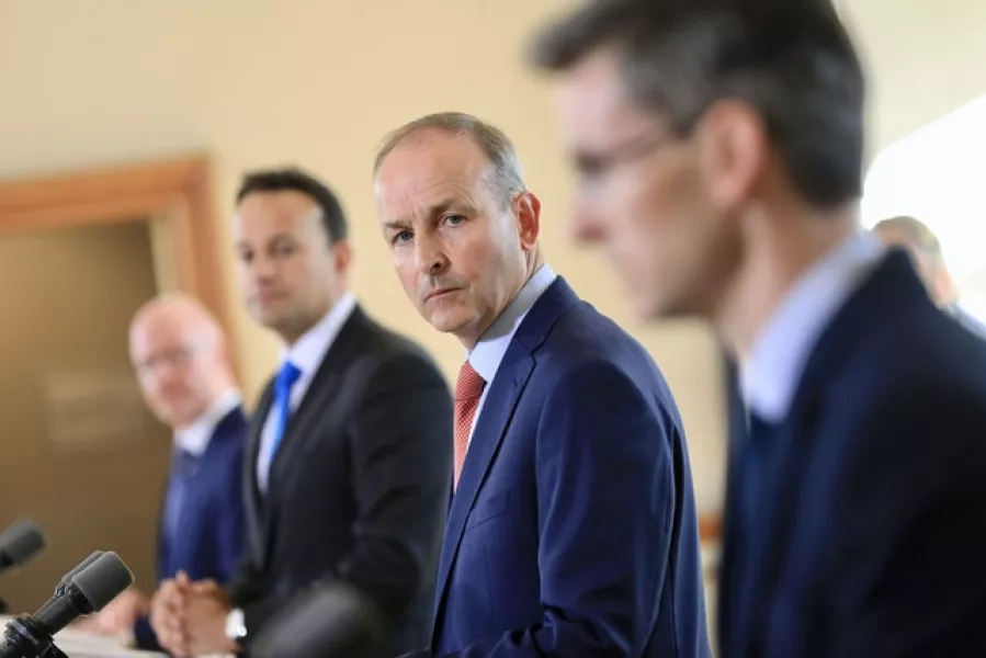 (left to right) Minister for Health Stephen Donnelly, Tánaiste Leo Varadkar, Taoiseach Micheál Martin and Dr Ronan Glynn during the post cabinet press briefing. Photo: Julien Behal Photography/PA