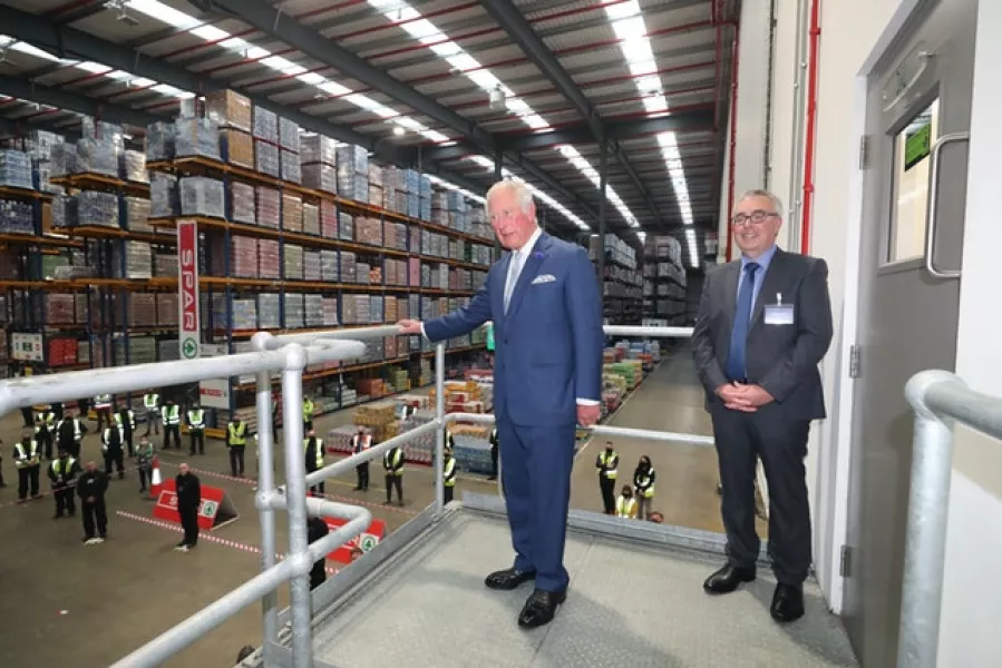 Martin Agnew (right) gives the Prince of Wales a tour of the Henderson Group’s food and grocery distribution centre in Newtownabbey, near Belfast (Niall Carson/PA)