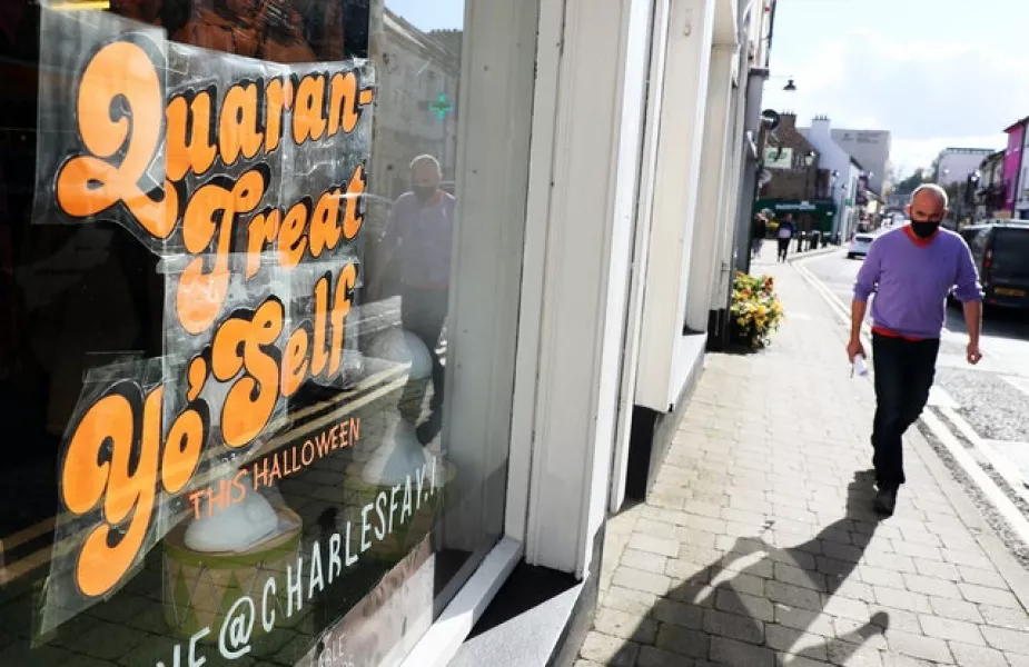 A sign in the window of a clothes shop on Main street, Cavan, as counties Donegal, Cavan and Monaghan prepare to move to Level 4 from midnight (Brian Lawless/PA)