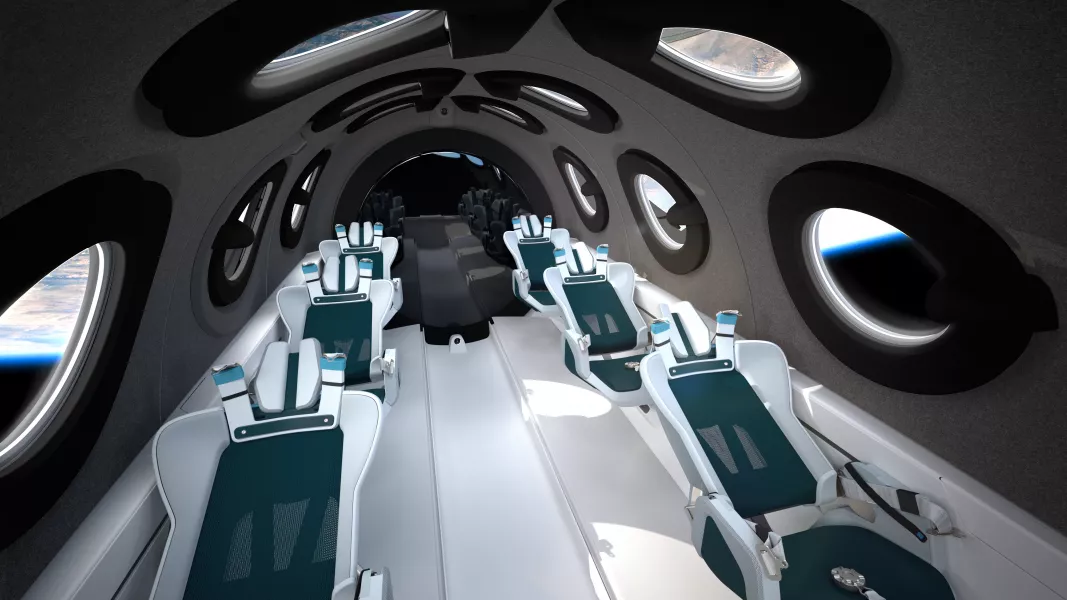 The cabin will include automated mood lighting and reclining seats with ‘G-Force management’ (Virgin Galactic/PA)