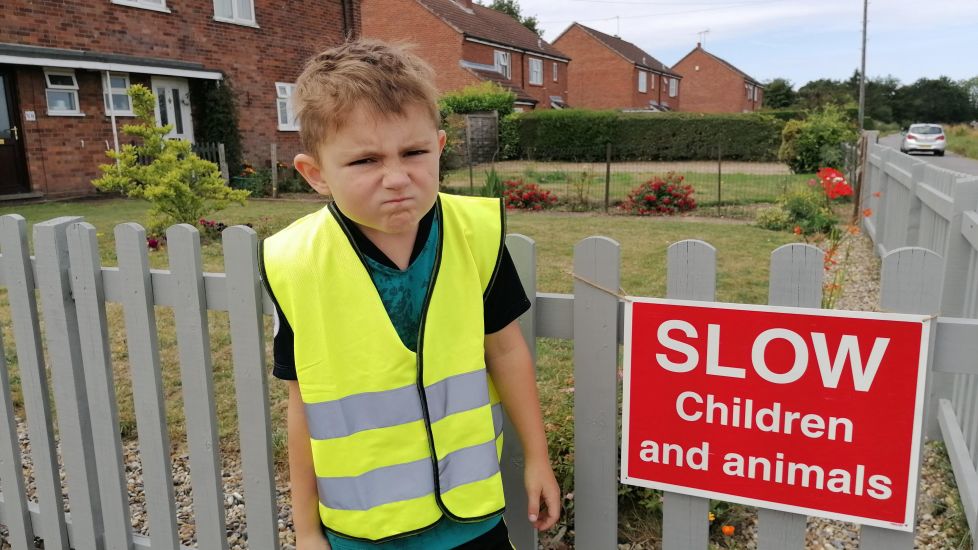 Seven-Year-Old Boy Polices Drivers Speeding Along His Road With ‘Stern Glare’