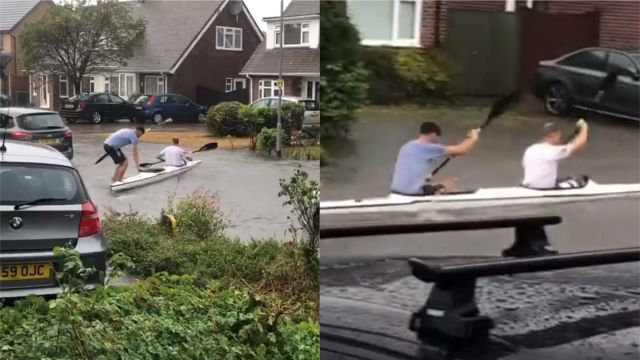 Kayakers Entertain Residents By Paddling Up And Down Flooded Uk Street