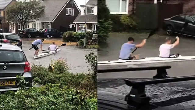 Kayakers Entertain Residents By Paddling Up And Down Flooded Uk Street