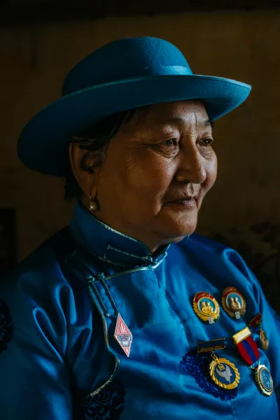 Dugerjav has 8 children and 22 grandchildren – in Mongolia, motherhood is seen as a patriotic duty and here she displays her Order of Glorious Motherhood medals (Kay Lockett/PA)