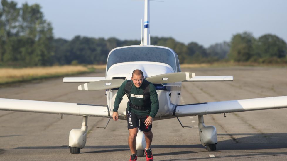 Kickboxer Completes Marathon Pulling A Plane