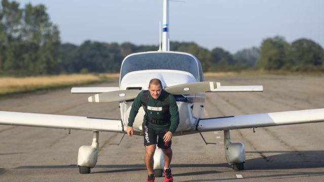 Kickboxer Completes Marathon Pulling A Plane