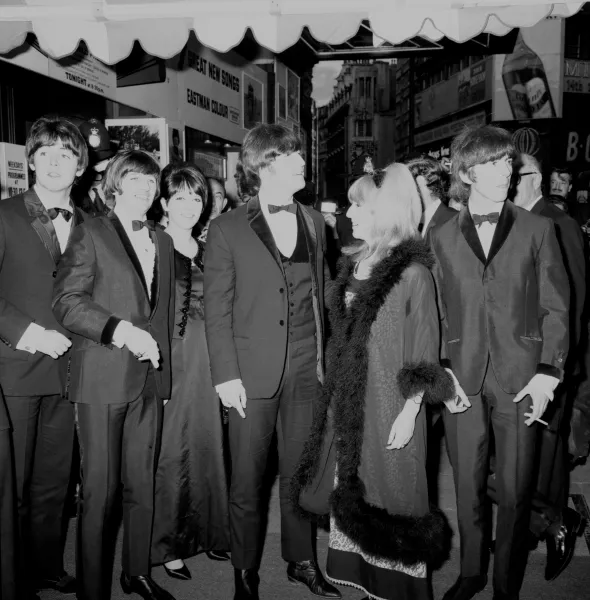 The Beatles arrive for the premiere of their film Help in 1965 (PA)
