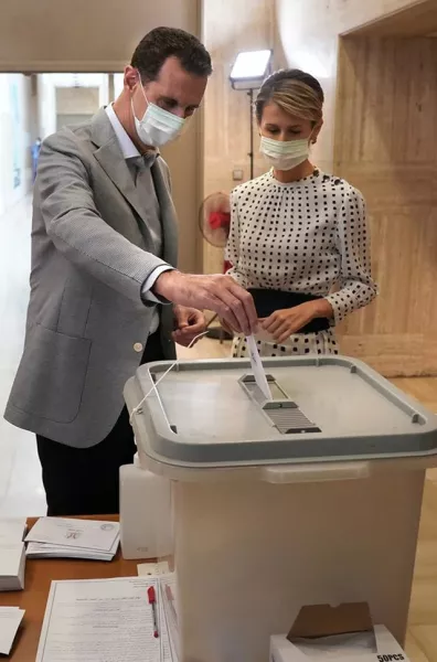 Mr Assad has twice postponed the country’s parliamentary elections this year in light of restrictions in place to combat the spread of the coronavirus (Syrian Presidency via AP)