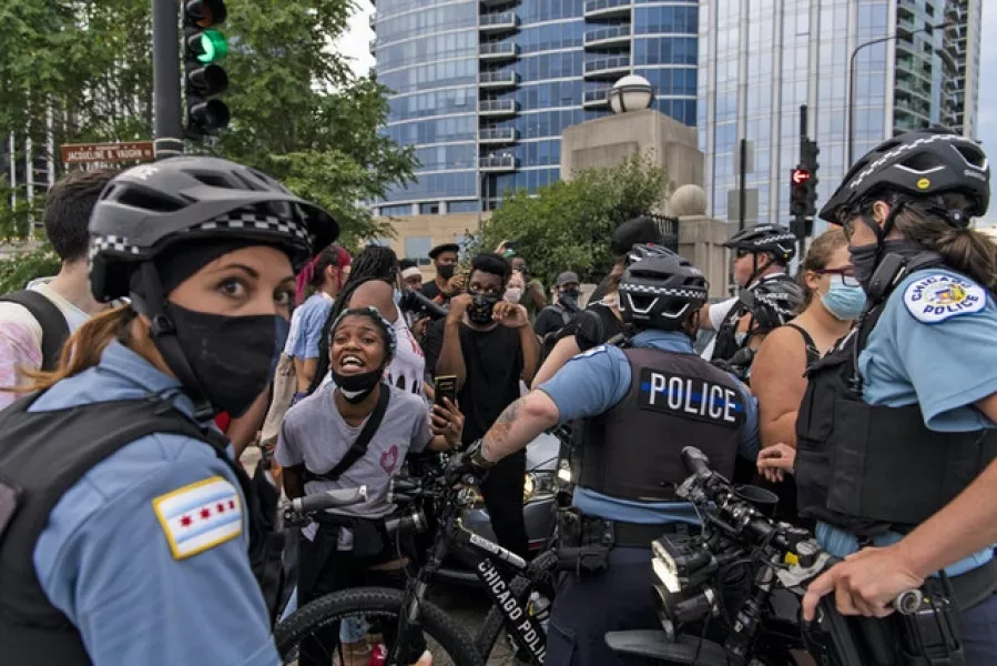 Police confront protesters in Chicago (Tyler LaRiviere/Chicago Sun-Times/AP)