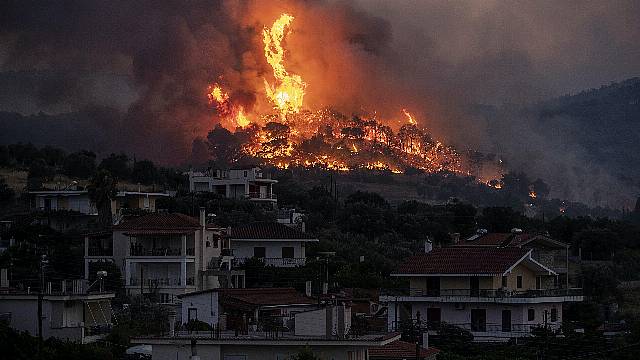 Firefighters Battle To Save Seaside Homes In Greece