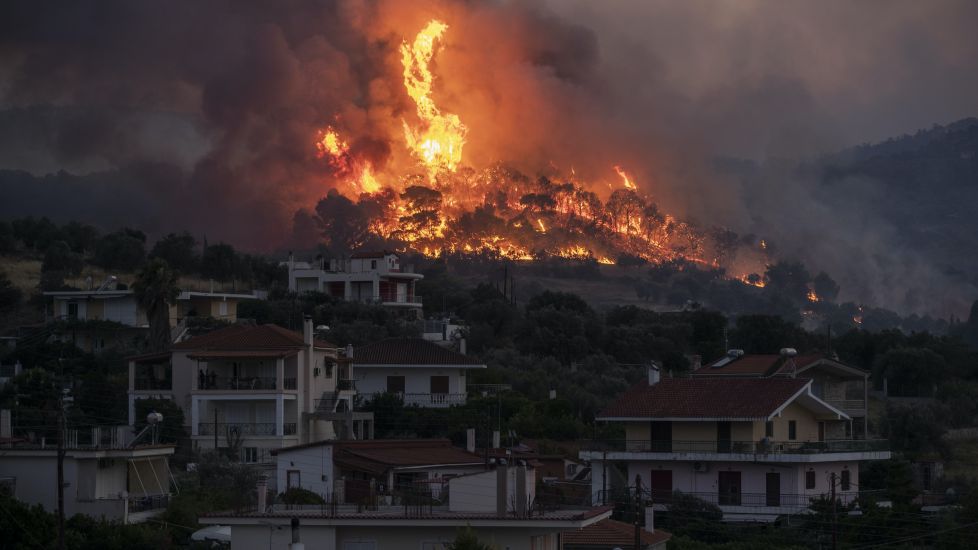Firefighters Battle To Save Seaside Homes In Greece