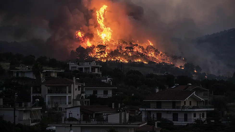 Firefighters Battle To Save Seaside Homes In Greece