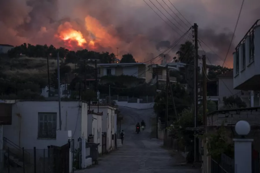 A fire burns near the village of Galataki, near Corinth (Petros Giannakouris/AP)