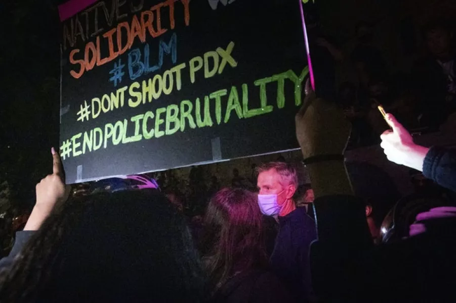 Mr Wheeler speaking with Black Lives Matter protesters in Portland (Noah Berger/AP)