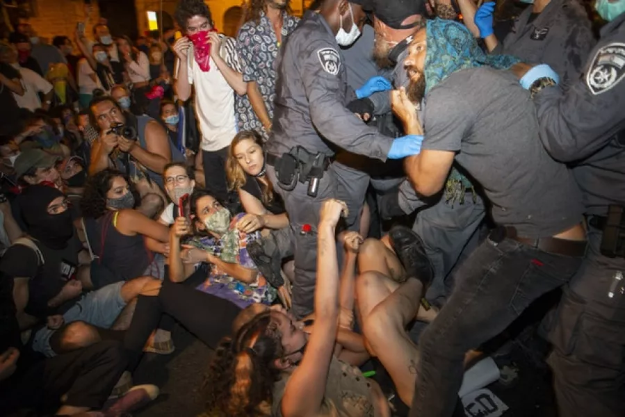 Israeli police scuffle with demonstrators (Ariel Schalit/AP)