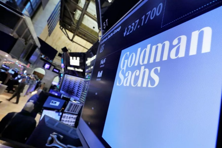 The logo for Goldman Sachs appears above a trading post on the floor of the New York Stock Exchange (Richard Drew/AP)