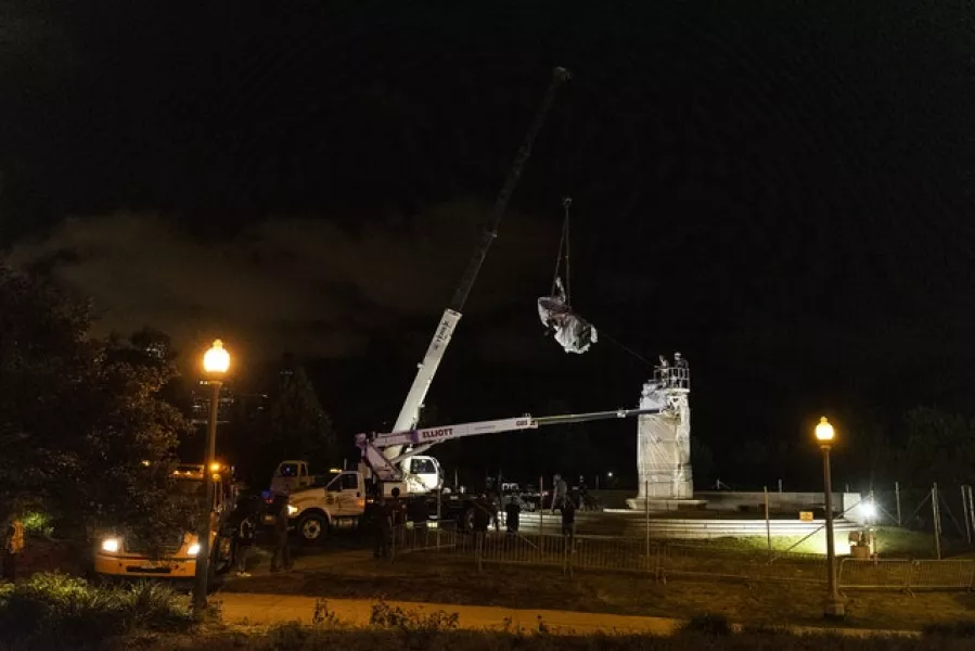 A crane removes the Christopher Columbus statue (Tyler LaRiviere/Sun-Times/AP)