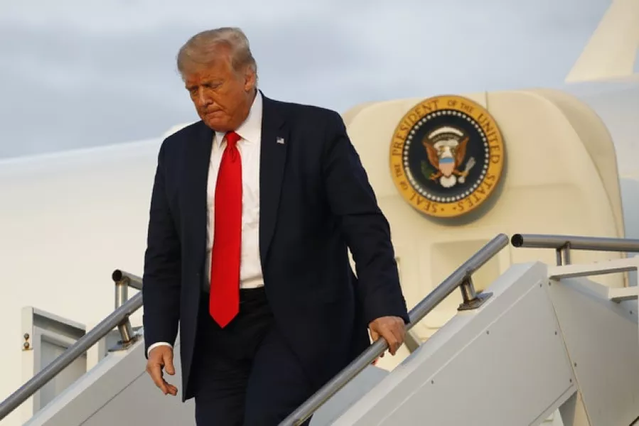 Donald Trump, seen here arriving in New Jersey where he will spend the weekend at one of his golf clubs, is pushing amid Covid-19 relief talks for government funding for a new FBI headquarters (Patrick Semansky/AP)