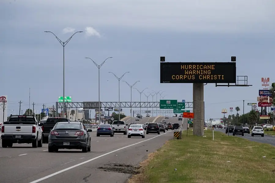 A sign reading Hurricane Warning Corpus Christi as Storm Hanna approaches (Courtney Sacco/Corpus Christi Caller-Times via AP)