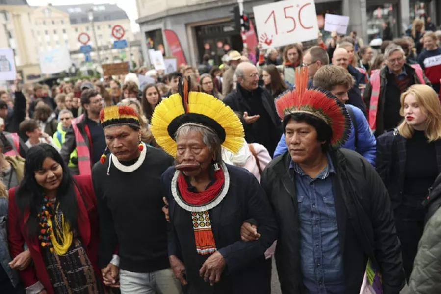 Chief Raoni Metuktire leads a march for climate in Brussels last year (AP)