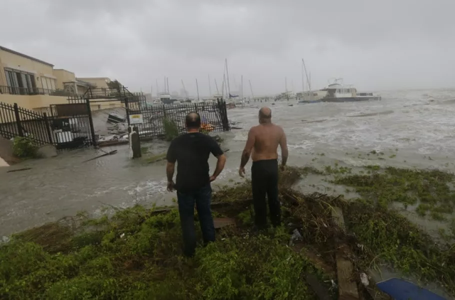 Boat owners examine the damage after the docks at the marina where their boats had been secured were destroyed as Hurricane Hanna made landfall in Corpus Christi, Texas (Eric Gay/AP)