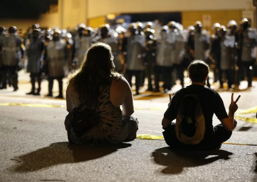 Police are thought to have deployed tear gas (James H Wallace/Richmond Times-Dispatch via AP)