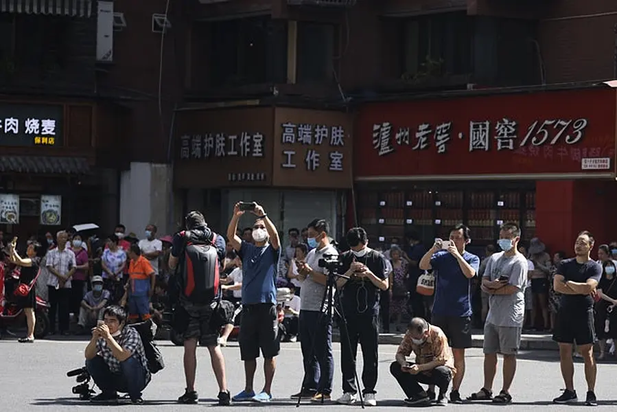 The consulate attracted plenty of public attention in the days before its closure (Ng Han Guan/AP)