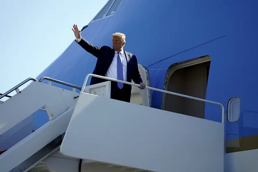 US President Donald Trump boards Air Force One for a trip to Texas (AP/Evan Vucci)