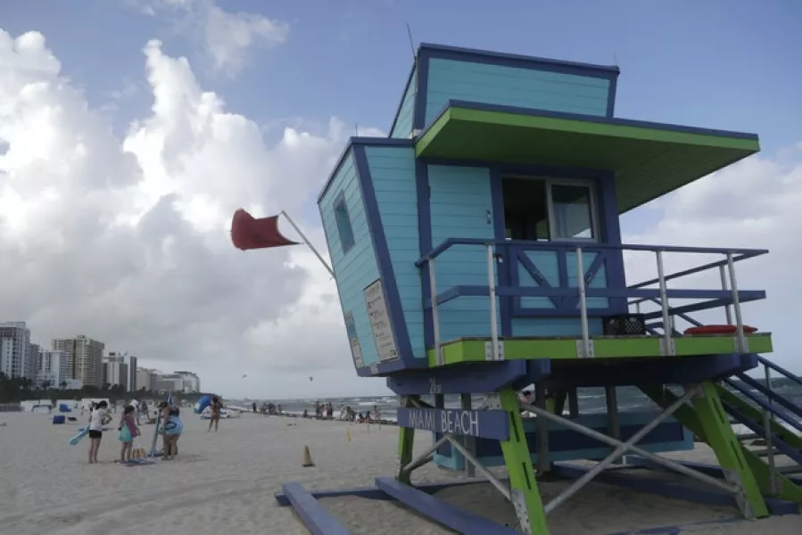 A red flag flies from a lifeguard station indicating high surf, in Miami Beach, Florida (Lynne Sladky/AP)