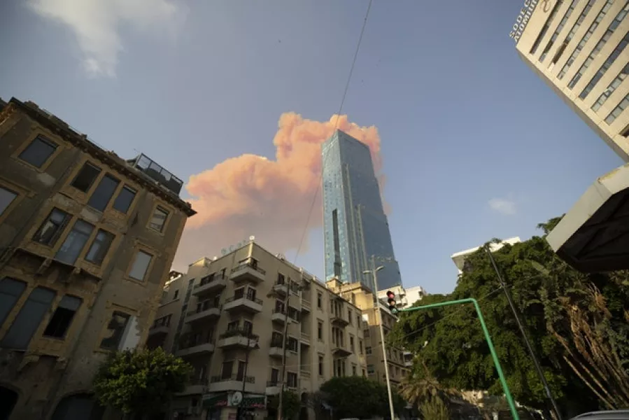 A cloud from a massive explosion is seen in in Beirut (Hassan Ammar/AP)