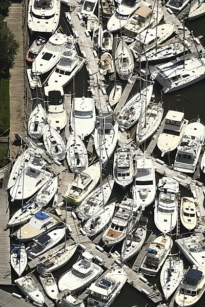 Boats stacked on top of each other in the Southport Marina in North Carolina (Ken Blevins/Wilmington Star-News/AP)