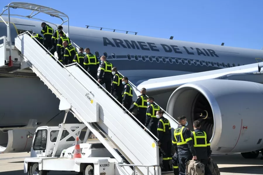 French Securite Civile rescue workers board a military plane bound for Lebanon (Bertrand Guay/Pool/AP)