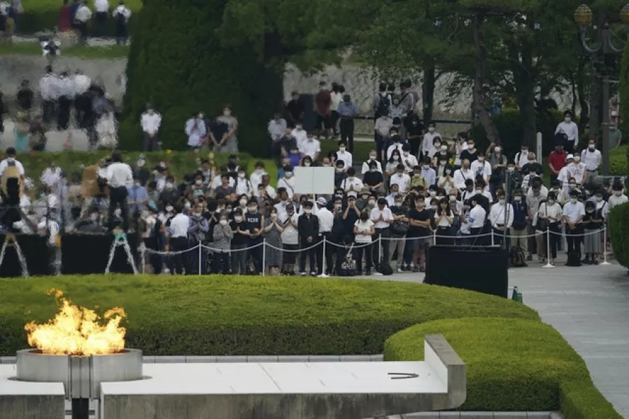 Visitors observe a minute of silence for the victims of the atomic bombing (Eugene Hoshiko/AP)
