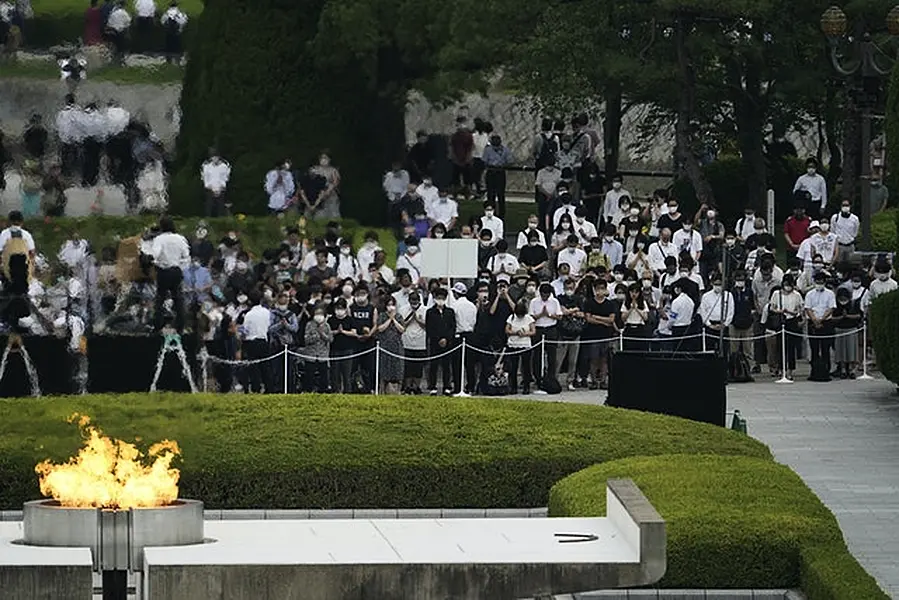 Visitors observe a minute of silence for the victims of the atomic bombing (Eugene Hoshiko/AP)