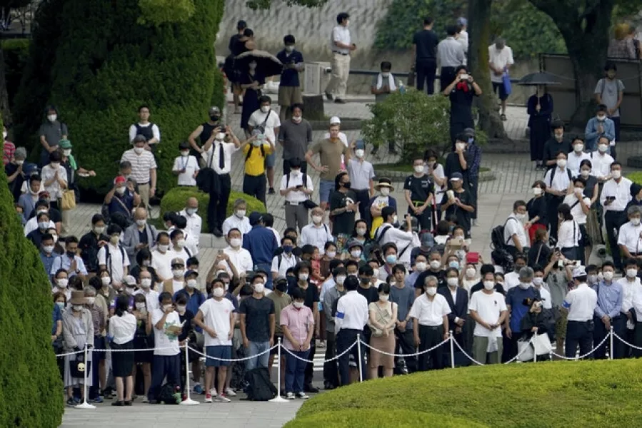 Visitors observed a minute of silence for the victims of the atomic bombing (AP Photo/Eugene Hoshiko)